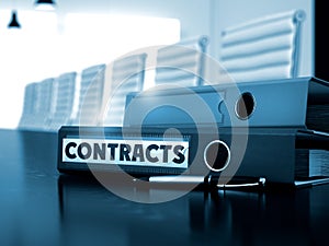 Contracts on Folder. Blurred Image. 3D.
