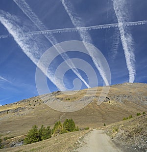 Contrails crossing, vapour trails made by jet in the sky symbol of air traffic