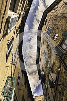 Contrapicado of a street in the city of Siena, Italy photo