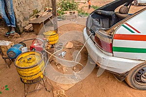 Contraption for refueling gas (non petrol/gasoline) tanks in taxis in Yamoussoukro Ivory Coast photo
