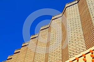 Contrast background yellow wall with blue sky photo