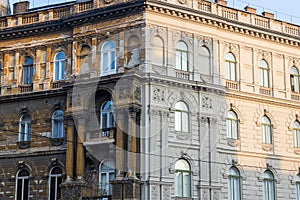 Contrast on the building in Budapest - one part of the house is renewed photo