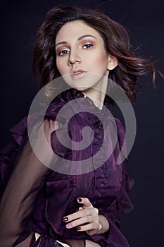 Contrast fashion Armenian woman portrait with big blue eyes on a