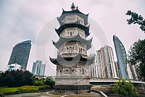 Contrast of modern buildings and historical pagoda in the city