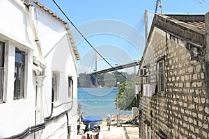 Contrast of Traditional Village and Modern Ting Kau Bridge in Hong Kong