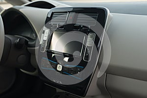 Control buttons on screen multimedia system. Car dashboard. Interior detail.