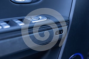 Control buttons for settings and memory of the driver& x27;s seat, electric glass opening, door handle in the