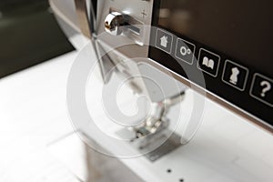 control buttons and touchscreen of a modern computerised sewing machine