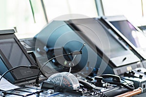 Control console (telegraph) on the navigational bridge of the cargo container ship.