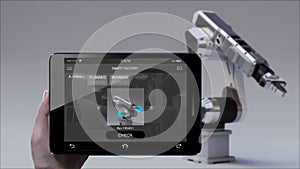 Control monitoring Robot arm in Smart factory UI. Using smart pad, tablet. internet of things. 4th industrial revolution.