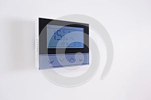 Control panel, air conditioning and heating system of the house, on a white wall, smart home