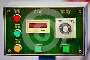 Control panel with English and Chinese labels in green design with counter
