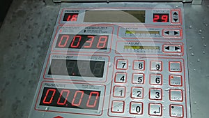 Control panel with red digits on the display monitor panel red button with buttons