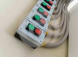 Control panel with 'Start' and 'Stop' buttons mounted on the wall