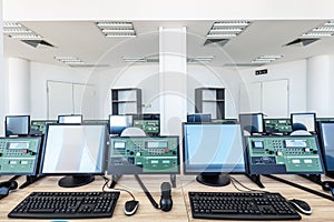 Control room with machines and computers