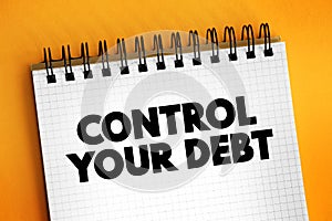 Control Your Debt text on notepad, concept background