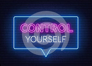 Control Yourself neon sign on brick wall background.