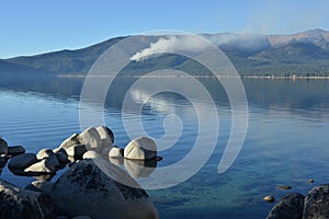 Controlled forest fire seen from Sand Harbor of Lake Tahoe