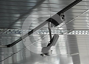 Controlled track spotlight on rail system in television studio