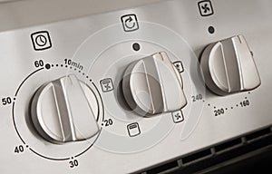 Controls of a modern stainless steel cooker