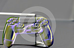 Controls and video game console on light background