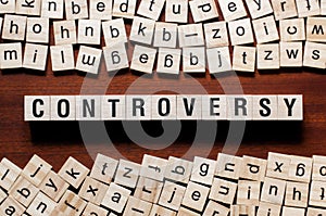 Controversy word concept on cubes