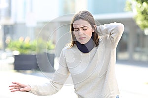 Convalescent dizzy woman walking in the street