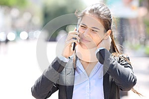 Convalescent executive wearing neck brace calling on phone