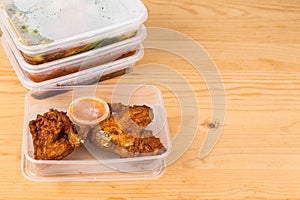 Convenient but unhealthy disposable plastic lunch boxes with meals