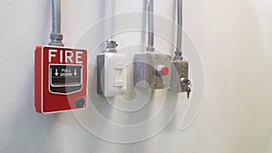 fire alarm pull stations and emergency switch on the wall