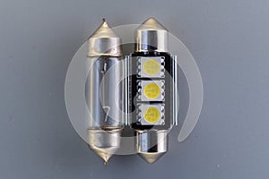 Conventional tungsten halogen bulb with light emitting diode, accessories and components for electronics vehicles. Gray background