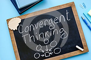 Convergent thinking handwritten on the small blackboard. photo
