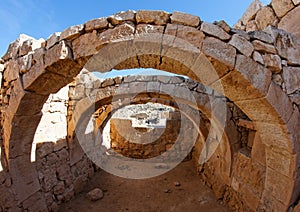 Converging ancient stone arches photo