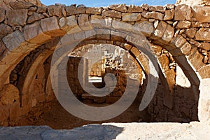 Converging ancient stone arches photo