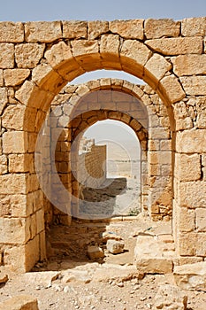 Converging ancient stone arches photo