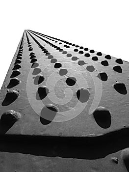 Converging Rivet Heads on Beam Isolated on White Background