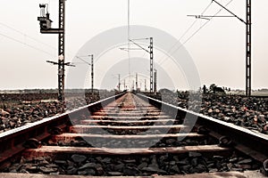 Converging train lines into horizon