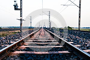 Converging train lines into horizon