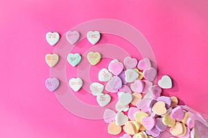 Conversation hearts on a pink background