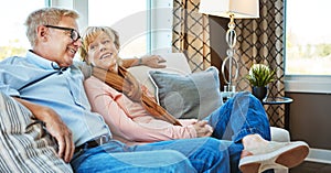 Conversation, mature or happy couple in home to relax, enjoy talking or joke together in retirement. Care, funny woman