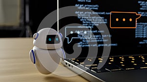 A conversational AI chatbot responds to a user\'s needs in front of a laptop. 3d photo