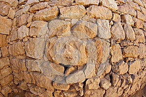 Convex ancient stone wall texture photo