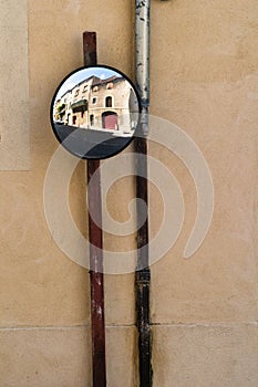 Convex mirror with old building