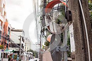 Convex mirror on pole on public road, Round Security Mirror for safety of entrances and exits or curves that are difficult to see