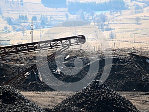 The conveyor belt ejects coal