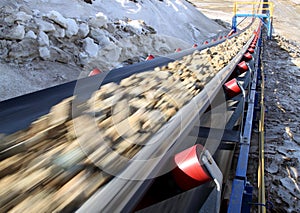Conveyor belt moves ore from the quarry for processing photo