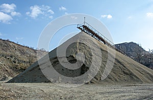 Conveyor belt at an old gravel quarry. Mining and quarrying equipment