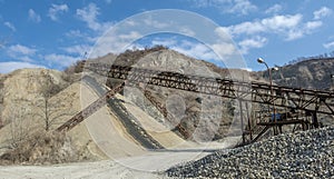 Conveyor belt at an old gravel quarry. Mining and quarrying equipment