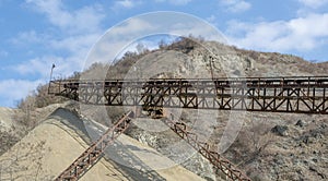 Conveyor belt at an old gravel quarry. Mining and quarrying equipment