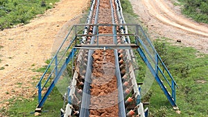 Conveyor belt transporting soil